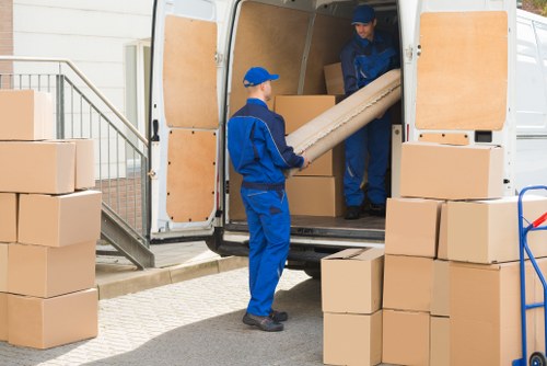 Man with van loading furniture for a local move