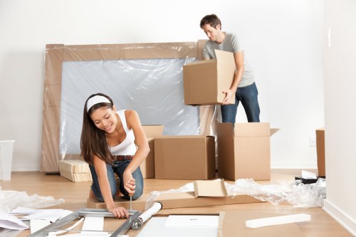 Mover handling boxes and household items with care