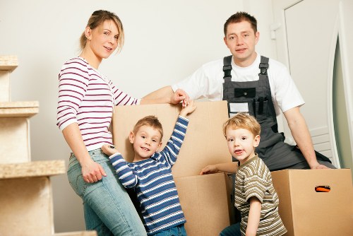 Careful loading of household items into a van in Cudham