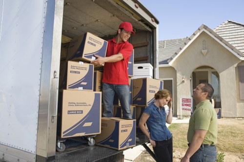 Insured van moving service handling furniture carefully