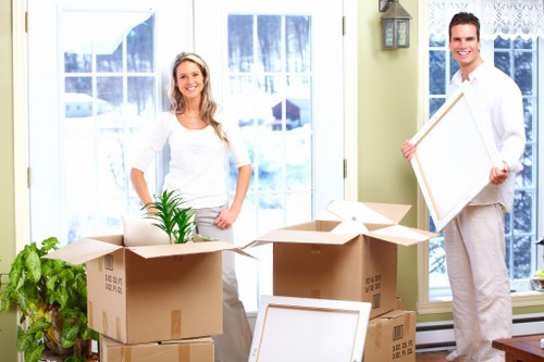 Movers carrying furniture for a local removals job near Cudham
