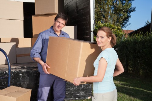 Professional movers loading household items carefully